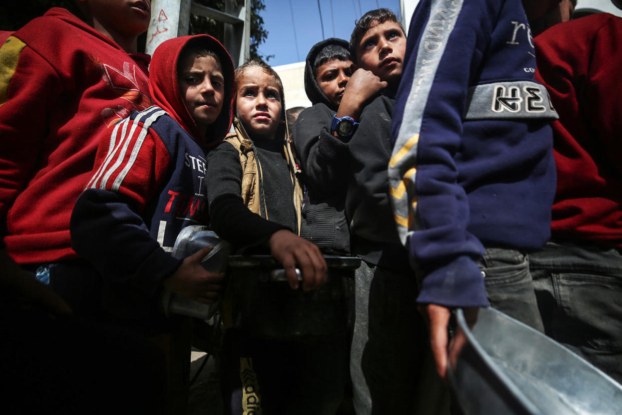 Humanitarian Aid in Gaza: Palestinians Receive Food Rations Amid Conflict (Majdi Fathi / NurPhoto via Getty Images)