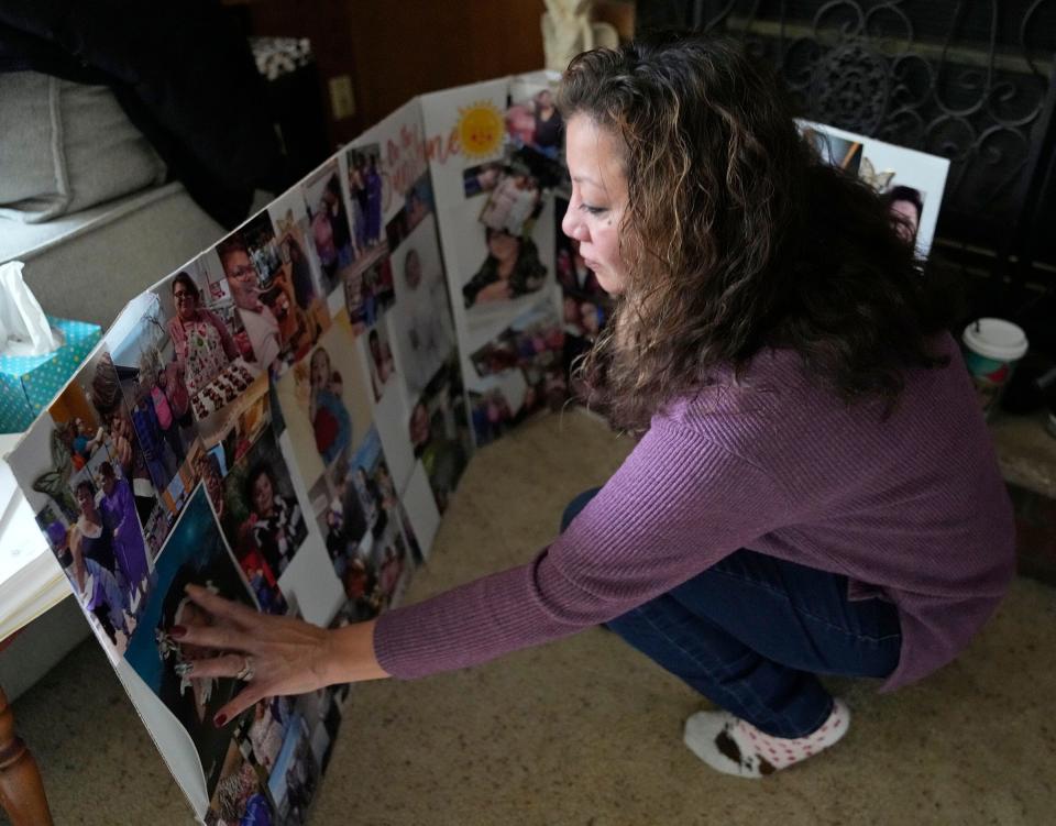 Kerrie Hirte looks at an assortment of photos of her daughter, Cilivea Thyrion, that were part of a memorial display for her funeral service. Thyrion died by apparent suicide at the Milwaukee County Jail Dec. 16, 2022. Hirte, seen at her home in Green Bay on Tuesday, Jan. 10, 2023, has questions about the circumstances surrounding her death and how, with a history of mental health, the jail failed to protect her and prevent her death despite rigorous protocols and policies laid out by the jail and the Milwaukee County Sherriff's Office.