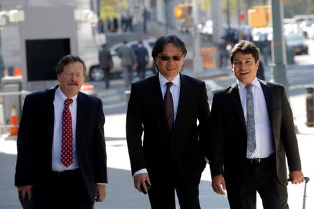 Former FIFA and CONCACAF executive committee member and former president of the Costa Rican soccer federation Eduardo Li (C) enters the Brooklyn Federal Court in Brooklyn, New York, U.S., October 7, 2016. REUTERS/Andrew Kelly