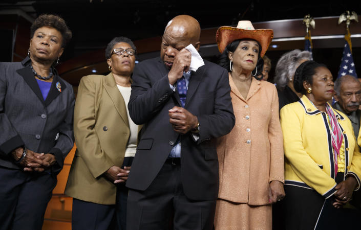 Civil right leader Rep. John Lewis, D-Ga., center, wipes his eyes as members of the Congressional Black Caucus make emotional statements condemning the slayings of police officers in Dallas last night, and the fatal police shootings of black men in Louisiana and Minnesota earlier in the week, during a news conference on Capitol Hill in Washington on July 8, 2016. From left are: Rep. Barbara Lee, D-Calif., Rep. Marcia L. Fudge, D-Ohio, Rep. John Lewis, D-Ga., Rep. Frederica Wilson, D-Fla., and Rep. Sheila Jackson Lee, D-Texas. (Photo: J. Scott Applewhite/AP)