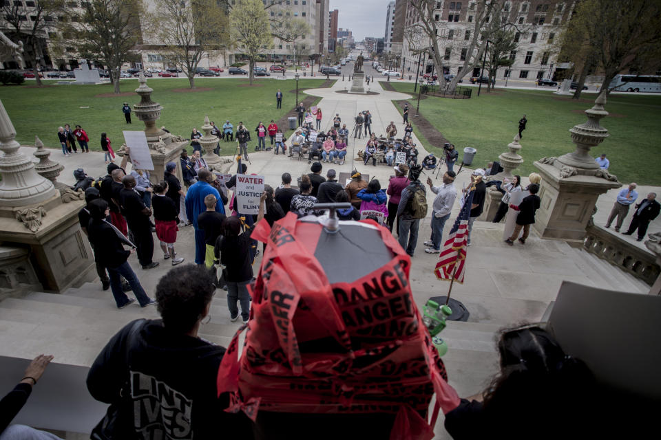 More than 50 Flint residents rally on the five-year anniversary of the Flint water crisis at the Capitol Building on Thursday, April 25, 2019, in Lansing, Mich. (Jake May/MLive.com/The Flint Journal via AP)