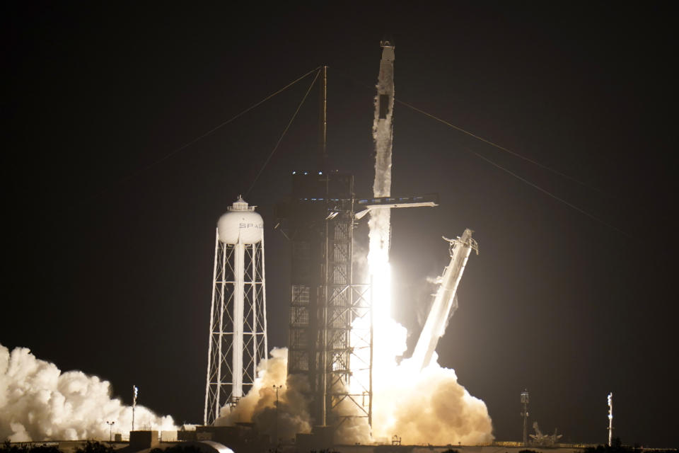 A SpaceX Falcon 9 rocket with the Crew Dragon space capsule lifts off from pad 39A at the Kennedy Space Center in Cape Canaveral, Fla., Friday, April 23, 2021. (AP Photo/John Raoux)