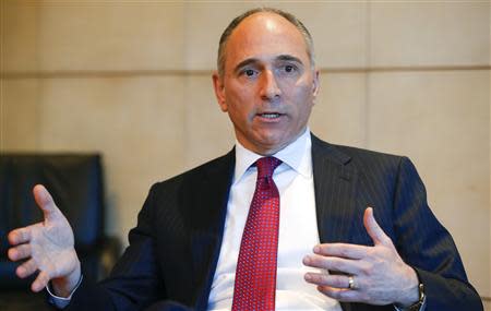 Joe Jimenez, CEO of Swiss drugmaker Novartis gestures during an interview with Reuters at the company's headquarters in Basel March 19, 2014. Reuters/Arnd Wiegmann