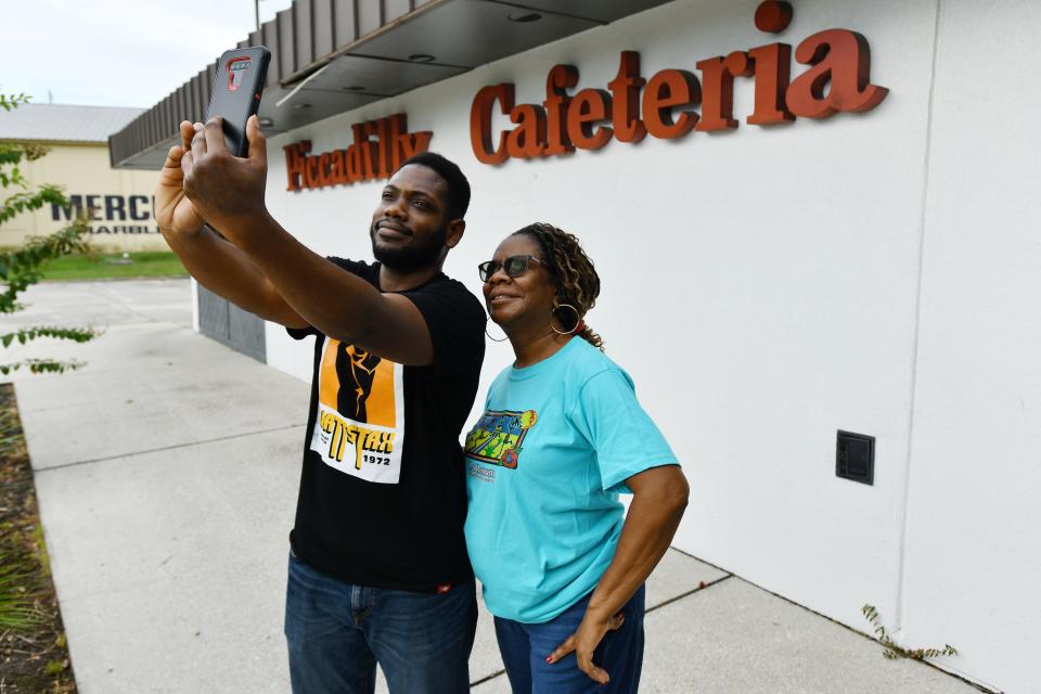 Warren Alston and his mother, Freida Crosier-Alston, take a selfie in front of Piccadilly Cafeteria as they wait for the restaurant to open for its final day of business on Tuesday, Sept. 26, 2023. "We are regulars," Freida said. "Every Sunday after church and on days I don't feel like cooking we would come here."