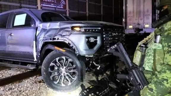 damaged gmc canyon truck on train tracks in meixco after attempted robbery