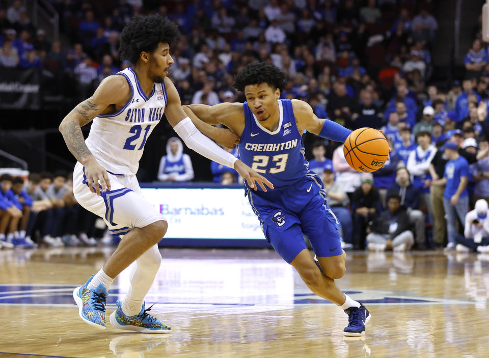 Creighton guard Trey Alexander (23) drives to the basket against Seton Hall guard Isaiah Coleman (21) during the first half of an NCAA college basketball game in Newark, N.J. Saturday, Jan. 20, 2024. (AP Photo/Noah K. Murray)