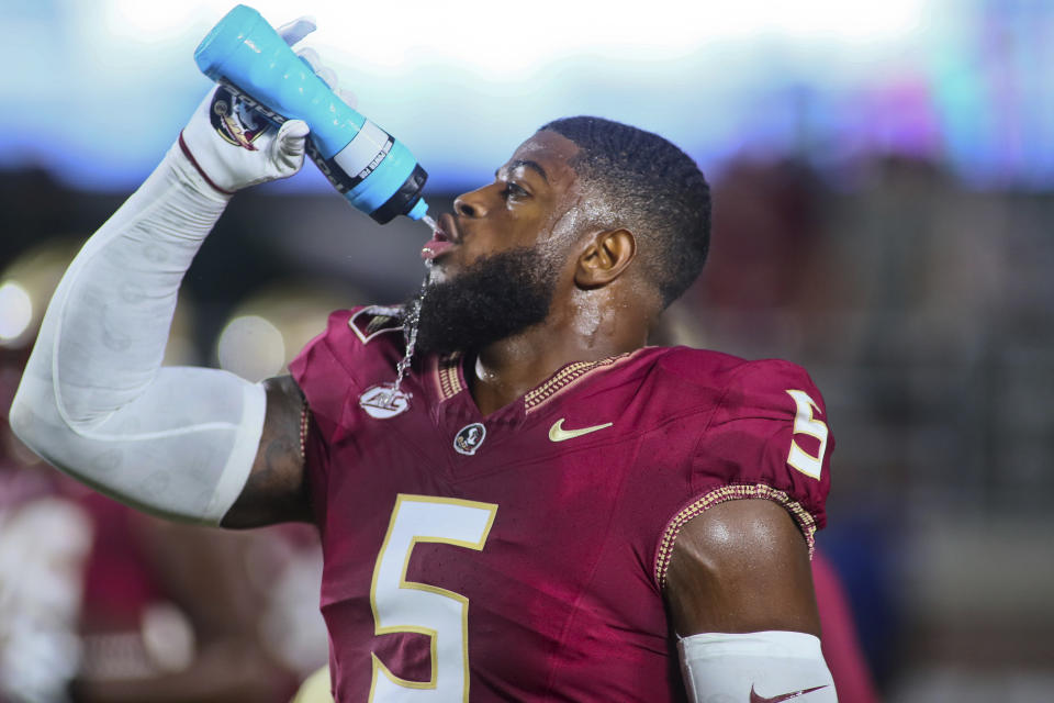 Florida State defensive end Jared Verse drinks before an NCAA college football game against Southern Mississippi, Saturday, Sept. 9, 2023, in Tallahassee, Fla. (AP Photo/Phil Sears)