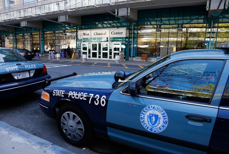 Police stand guard outside of Beth Israel Deaconess Medical Center on April 21, 2013, where the Boston Marathon bombing suspect, Dzhokhar A. Tsarnaev, 19, was charged with using and conspiring to use a weapon of mass destruction