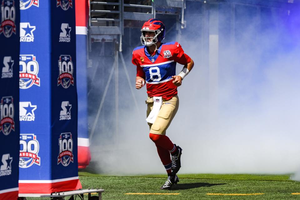 Sep 8, 2024; East Rutherford, New Jersey, USA; New York Giants quarterback Daniel Jones (8) enters the field during pregame introductions before a game against the Minnesota Vikings at MetLife Stadium. Mandatory Credit: John Jones-Imagn Images