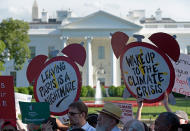 <p>Protesters gather outside the White House in Washington, Thursday, June 1, 2017, to protest President Donald Trump’s decision to withdraw the Unites States from the Paris climate change accord. (AP Photo/Susan Walsh) </p>