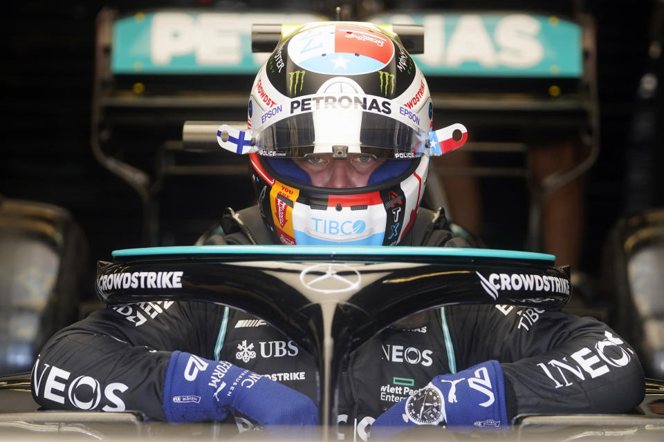 Mercedes driver Valtteri Bottas, of Finland, climbs into his car during a practice session for the Formula One U.S. Grand Prix auto race at the Circuit of the Americas, Saturday, Oct. 23, 2021, in Austin, Texas. (AP Photo/Darron Cummings)