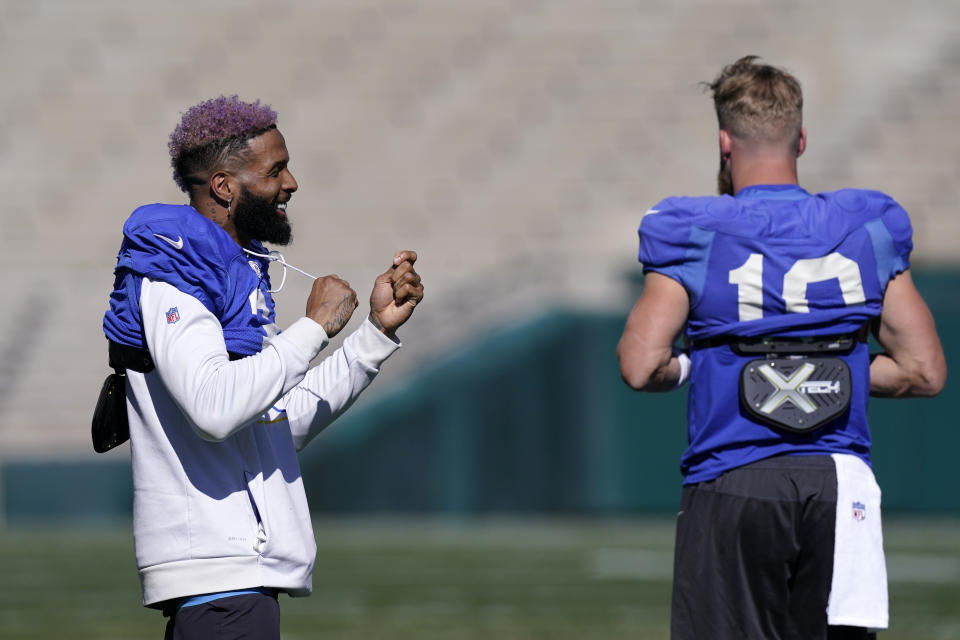 Los Angeles Rams wide receiver Odell Beckham Jr., left, and wide receiver Cooper Kupp chat during practice for an NFL Super Bowl football game Thursday, Feb. 10, 2022, in Pasadena, Calif. The Rams are scheduled to play the Cincinnati Bengals in the Super Bowl on Sunday. (AP Photo/Mark J. Terrill)