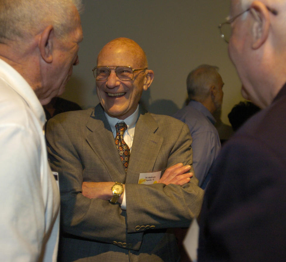 FILE - Apollo 13 Command Module Pilot, Thomas Kenneth Mattingly, center, speaks with guests during GlobalSpec's presentation of a Great Moments In Engineering Award at Space Center Houston, April 19, 2005. Mattingly, an astronaut who is best remembered for his efforts on the ground that helped bring the damaged Apollo 13 spacecraft safely back to Earth, has died Tuesday, Oct. 31, 2023, NASA announced. (AP Photo/Carlos Javier Sanchez, File)