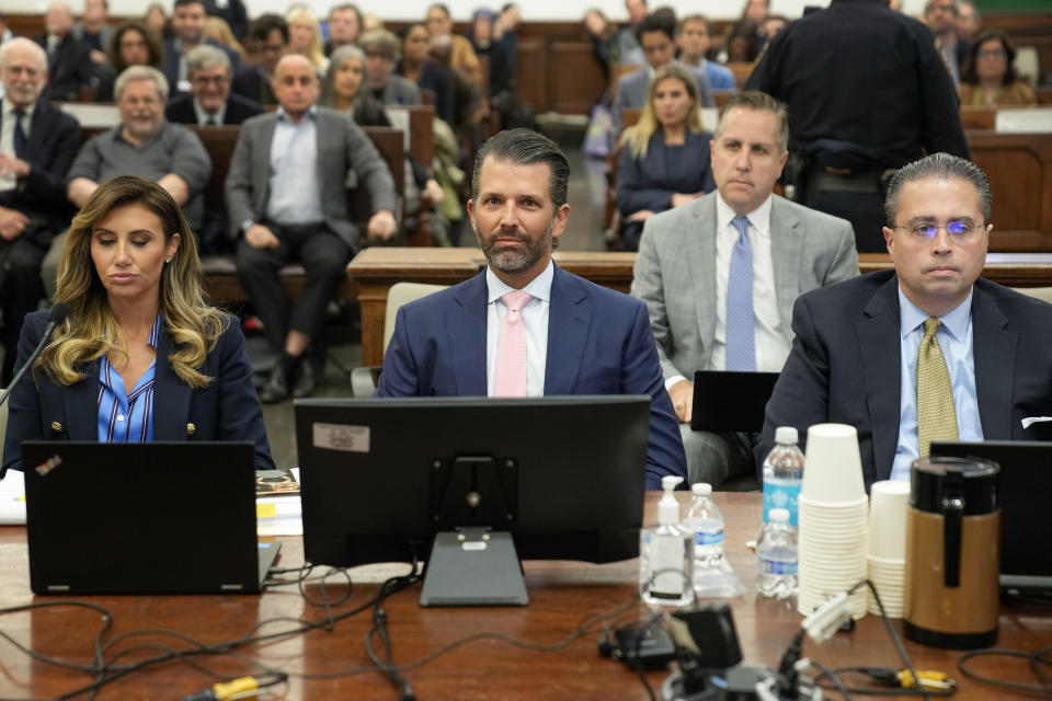 Flanked by attorneys, Donald Trump Jr. waits to testify in a New York courtroom on Wednesday, Nov. 1, 2023. / Credit: Seth Wenig / AP