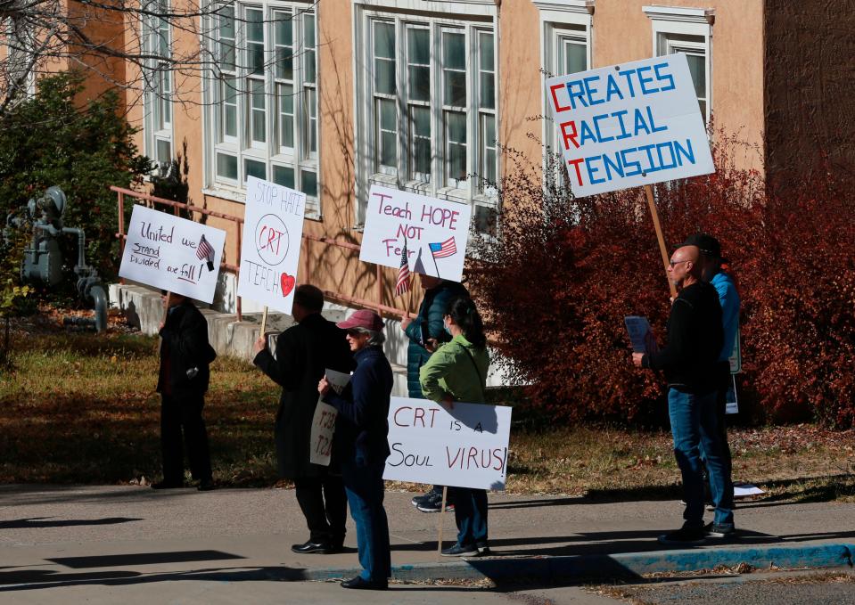 People protest outside the offices of the New Mexico Public Education Department&#39;s office, Friday, Nov. 12, 2021, in Albuquerque, New Mexico.