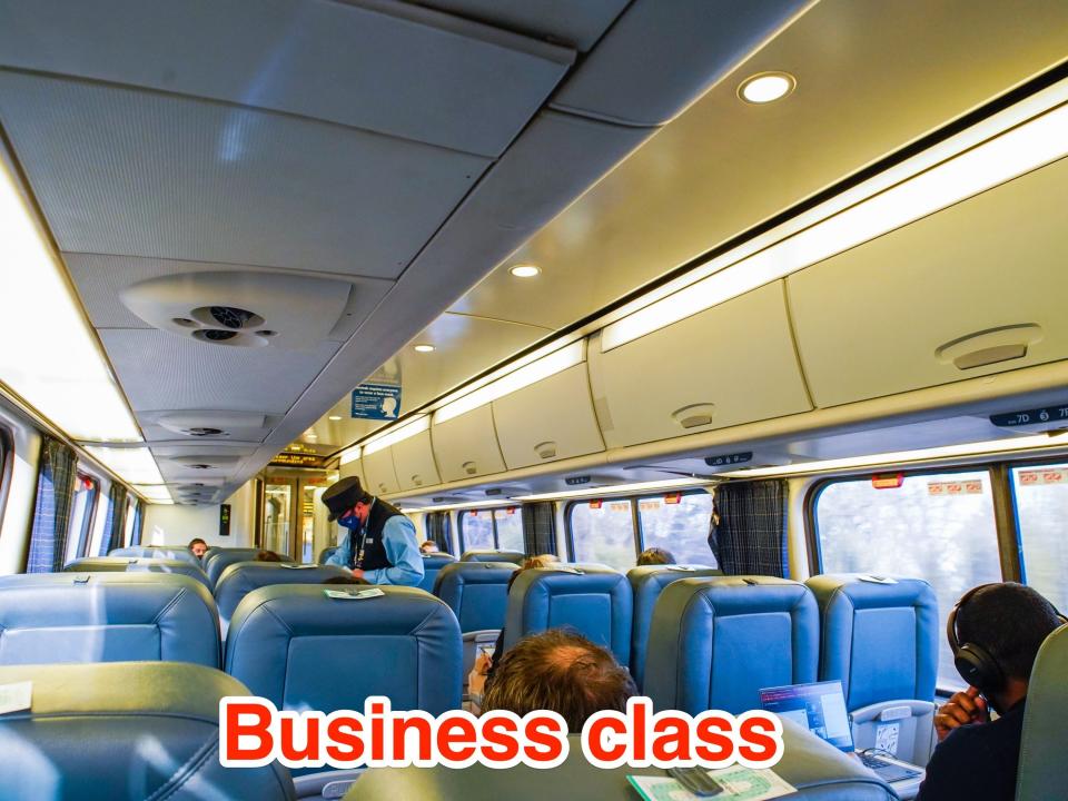 Inside a business class car on Amtrak A business-class car on an Amtrak train.