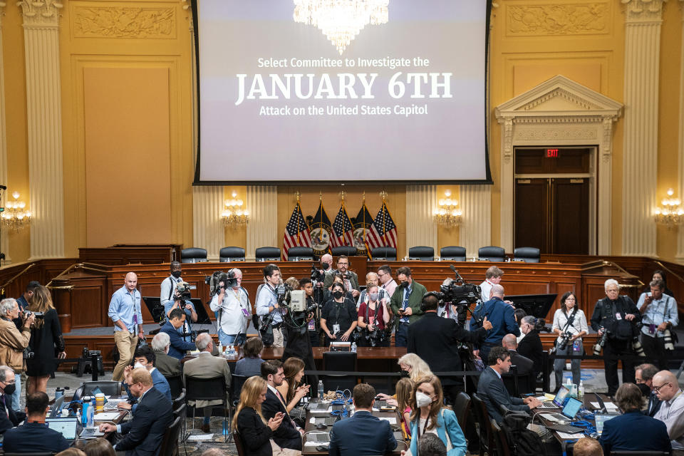 Members of the news media wait for the arrival of Cassidy Hutchinson, former aide to Trump White House chief of staff Mark Meadows as the House select committee investigating the Jan. 6 attack on the U.S. Capitol prepares to start a hearing at the Capitol in Washington, Tuesday, June 28, 2022. (Sean Thew/Pool via AP)