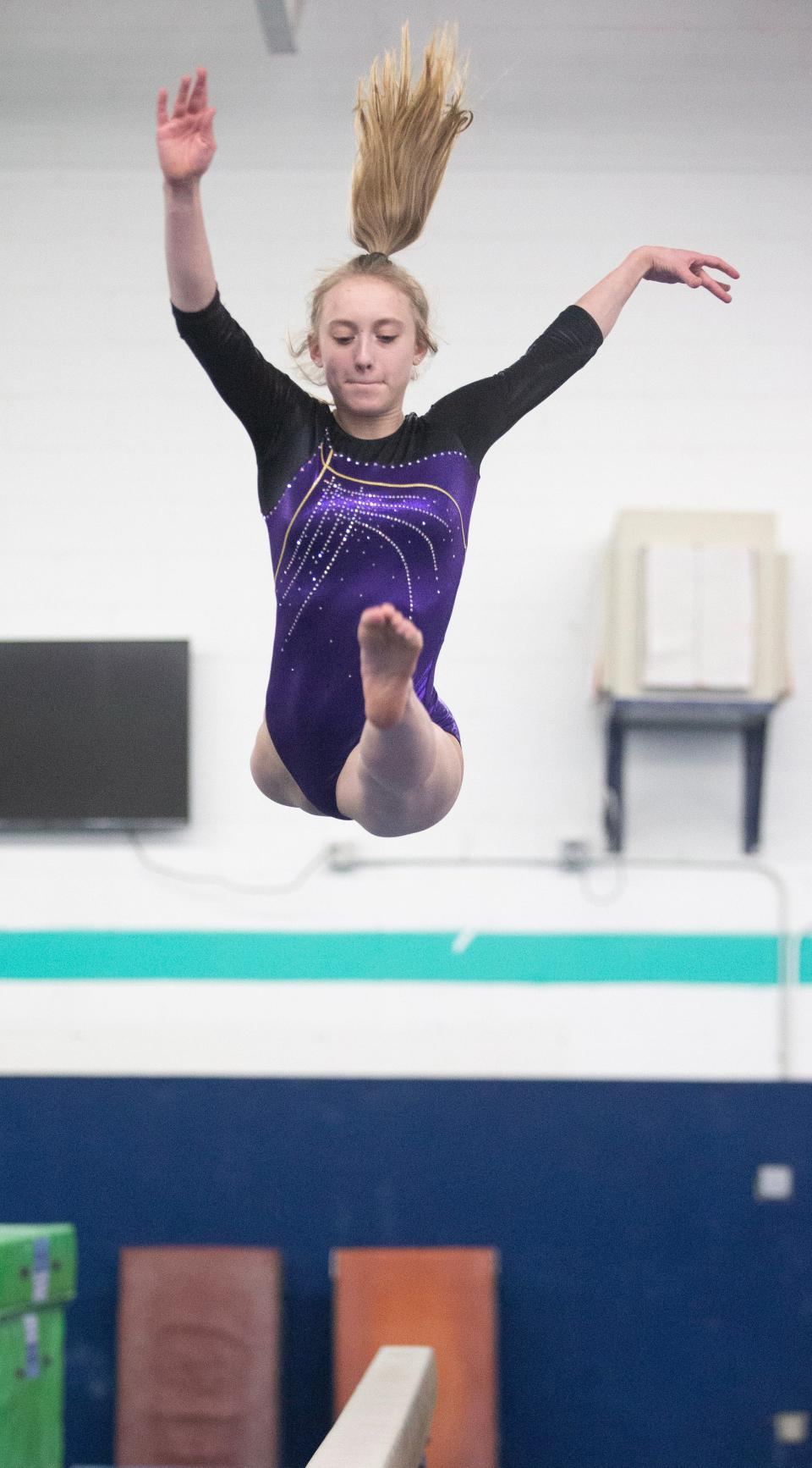 Jackson High School senior gymnast Kiara Hockman practices at the North Canton YMCA Gymnastics Center.