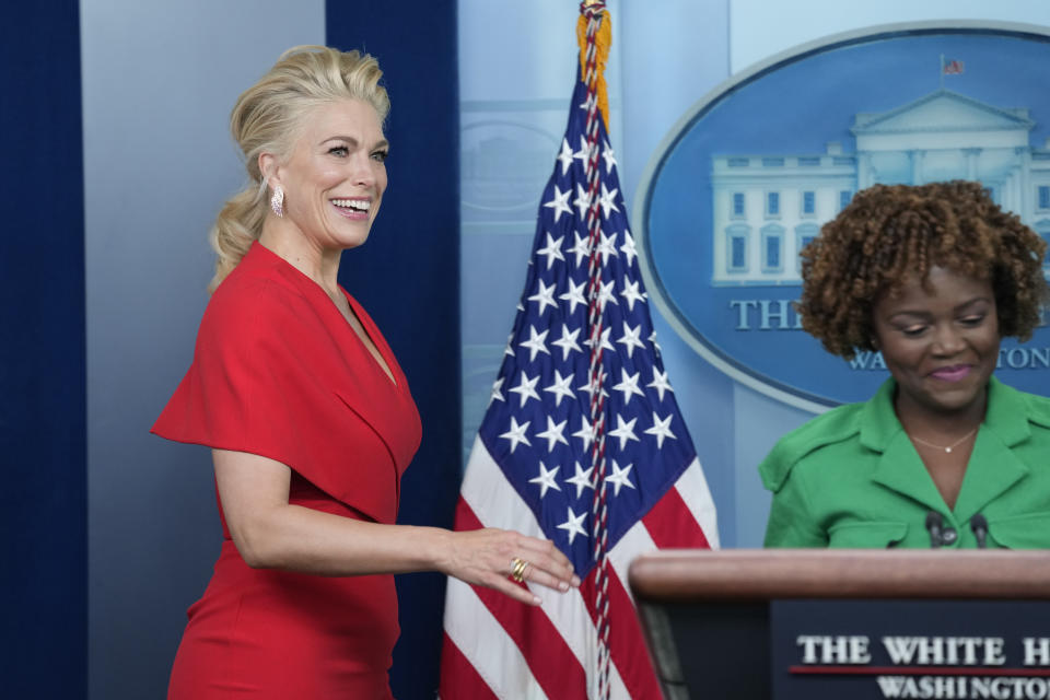 Hanna Waddington, who plays Rebecca Welton in the Apple TV+ series “Ted Lasso”, walks out to join White House press secretary Karine Jean-Pierre, right, at the daily press briefing at the White House in Washington, Monday, March 20, 2023. Members of the show were at the White House to meet with President Joe Biden to discuss the importance of mental health. (AP Photo/Susan Walsh)