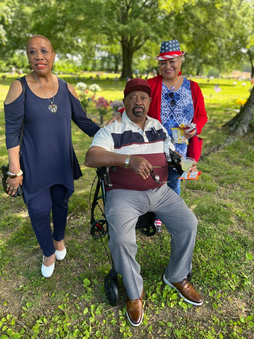 (Left) Charline Crosby, Jerry Webster and Lena Young attend the Memorial Day ceremony at Pinecrest Memorial Gardens and visit family members buried at the cemetery on Monday, May 29, 2023.