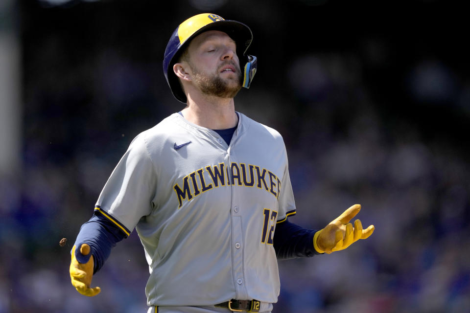 Milwaukee Brewers' Rhys Hoskins reacts after Chicago Cubs' Mike Tauchman caught his deep fly ball during the fourth inning of a baseball game Friday, May 3, 2024, in Chicago. (AP Photo/Charles Rex Arbogast)