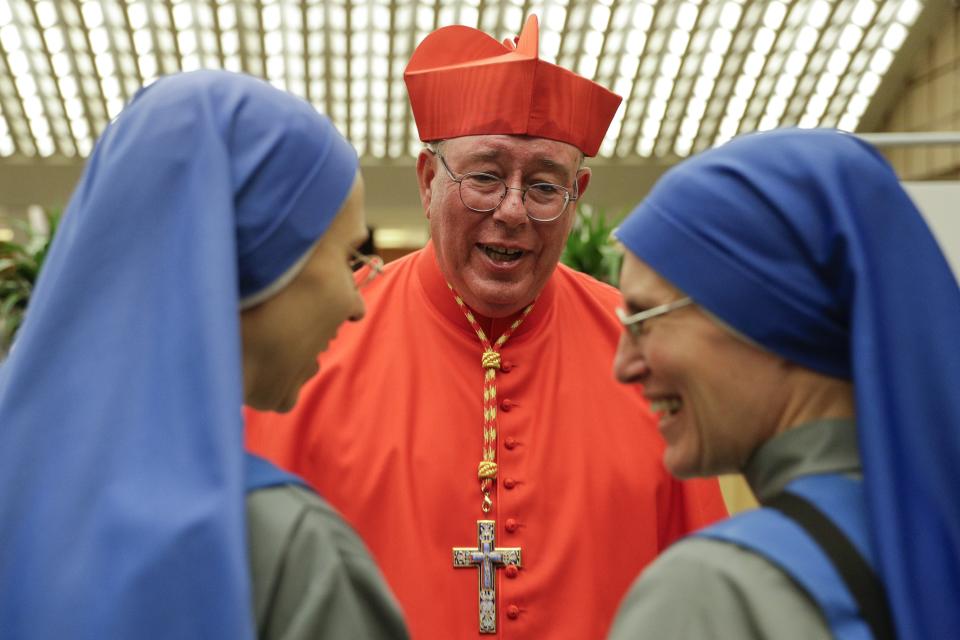 Cardinal Jean-Claude Hollerich poses for photographers prior to meeting relatives and friends after he was elevated to cardinal by Pope Francis, at the Vatican, Saturday, Oct. 5, 2019. Pope Francis has chosen 13 men he admires and whose sympathies align with his to become the Catholic Church's newest cardinals. (AP Photo/Andrew Medichini)