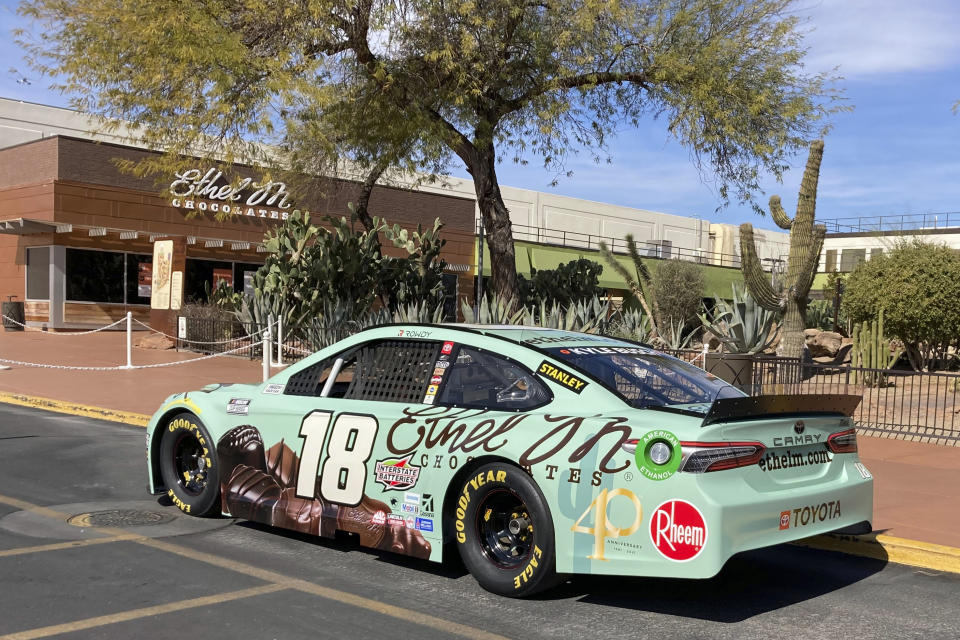 NASCAR driver Kyle Busch's car is parked outside Ethel M Chocolates in Henderson, Nev. Busch first went to the Ethel M candy factory with his grandmother. It wasn’t a tourist stop to the young Busch, it was a candy store and his grandmother let him roam the cactus garden and rewarded him with the craft chocolates. Ethel M is part of the Mars Corp., the longtime sponsor of Busch’s team. Busch will feature the brand on his car in Sunday’s race. (AP Photo/Jenna Fryer)