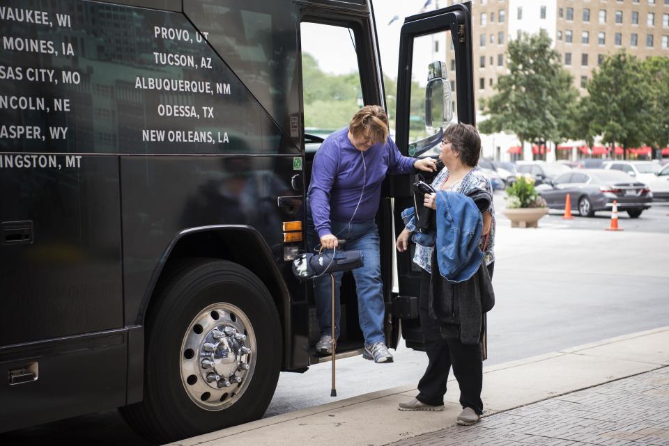 Rainie Jazeh and Diana Jones get off the bus after an interview.