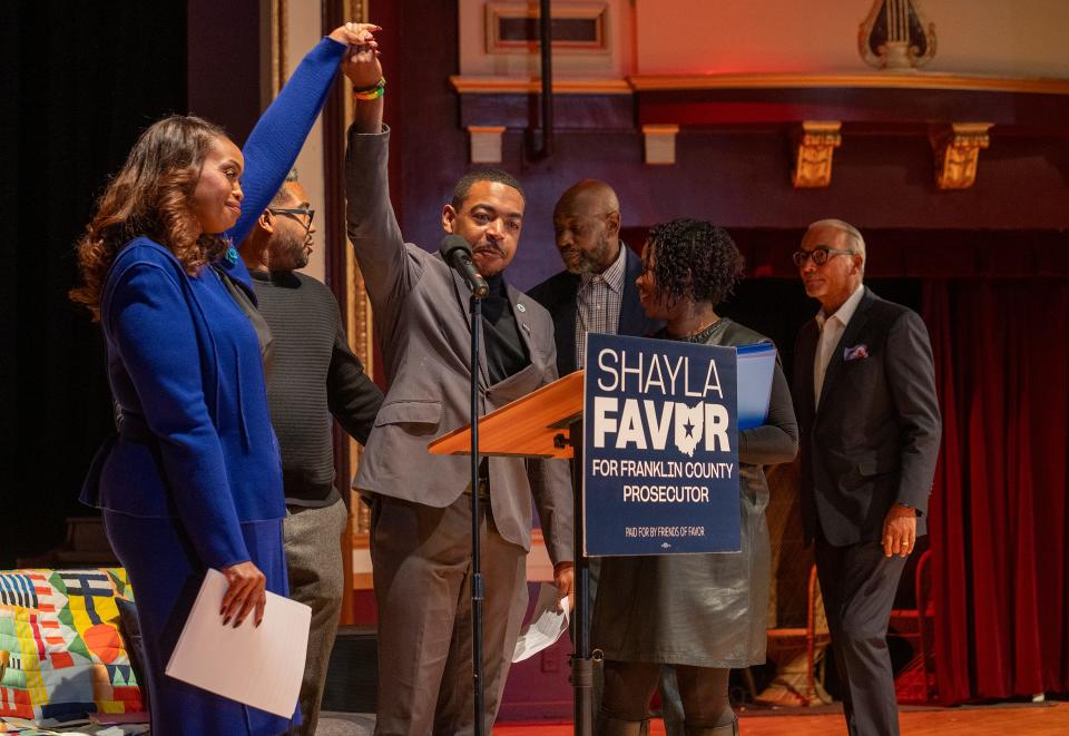 Nov 30, 2023; Columbus, USA, Ohio; City Councilman Shannon Hardin holds hands with City Councilwoman Shayla Favor to cheer her on during an announcement of Favors candidacy for Franklin County Prosecutor during an event at the Pythian Theater.
