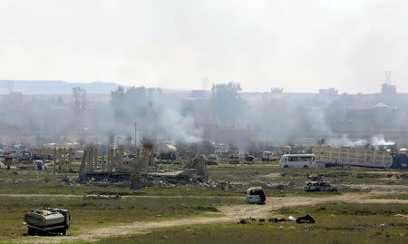 FILE PHOTO: Plumes of smoke rise in Baghouz, Deir Al Zor province, Syria March 3, 2019. REUTERS/Rodi Said