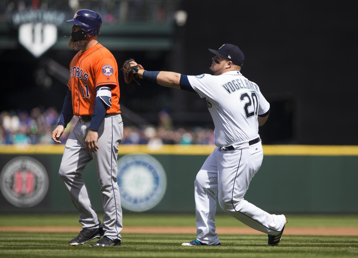 The Mariners needed some help from Evan Gattis to pull off this triple play. (Getty Images)