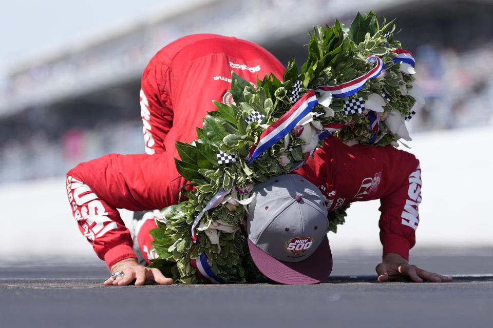 Marcus Ericsson, of Sweden, celebrates after winning the Indianapolis 500 auto race by kissing the yard of bricks at Indianapolis Motor Speedway in Indianapolis, Sunday, May 29, 2022. (AP Photo/AJ Mast)