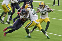 Green Bay Packers wide receiver Davante Adams (17) runs with the ball as Packers running back Jamaal Williams (30) blocks Houston Texans safety Justin Reid (20) during the first half of an NFL football game Sunday, Oct. 25, 2020, in Houston. (AP Photo/Eric Christian Smith)