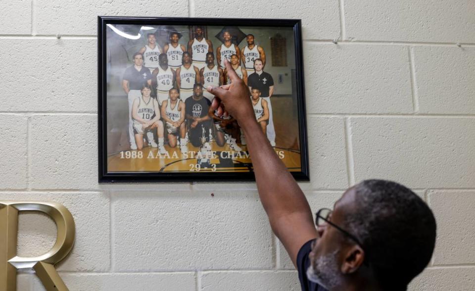 A framed photograph of the 1988 Lower Richland championship team hangs in head basketball coach Jo Jo English’s office. English (4) played ball with Stanley Roberts (53). Both English and Roberts went on to play in the NBA.
