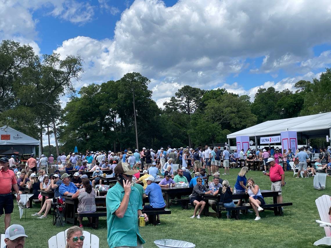 Spectators gather in an amenity area near Hole 17 at the Dunes Golf & Beach Club during the inaugural Myrtle Beach Classic. The 2024 Myrtle Beach Classic has a $3.9 million event purse.
