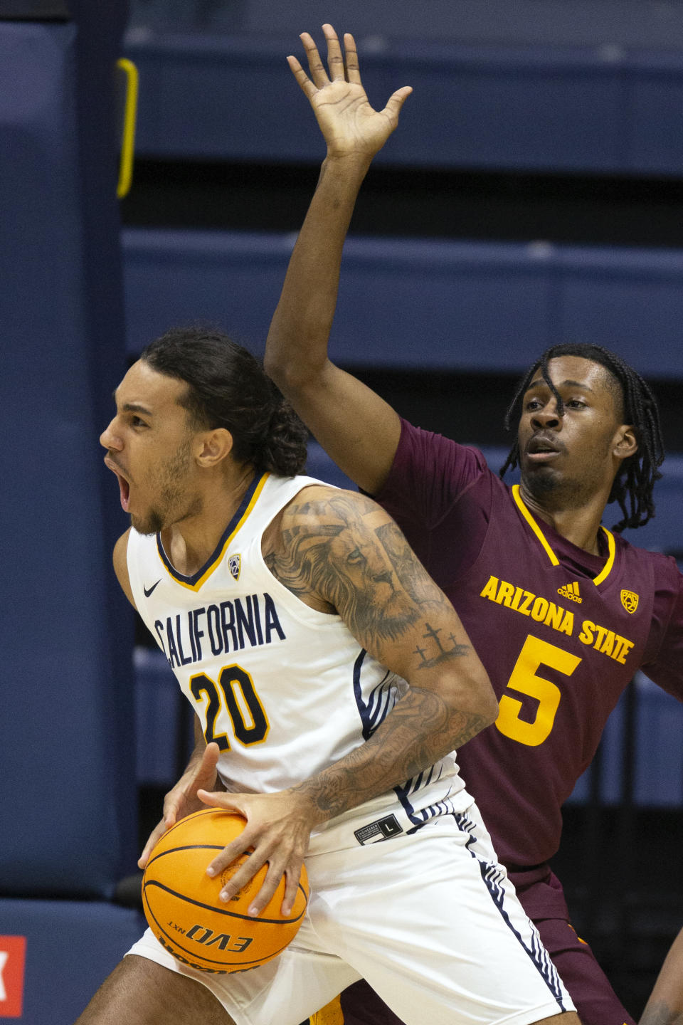 California guard Jaylon Tyson (20) drives to the hoop past Arizona State guard Jamiya Neal (5) during the first half of an NCAA college basketball game, Sunday, Dec. 31, 2023, in Berkeley, Calif. (AP Photo/D. Ross Cameron)