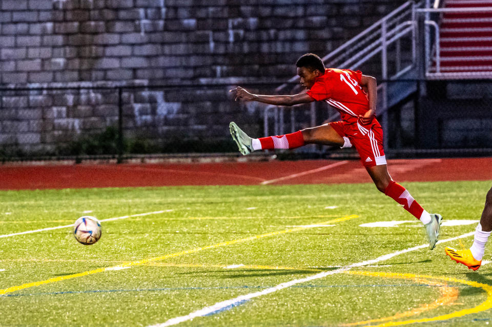 New Bedford's Carlentz Jean Piere fires on goal.