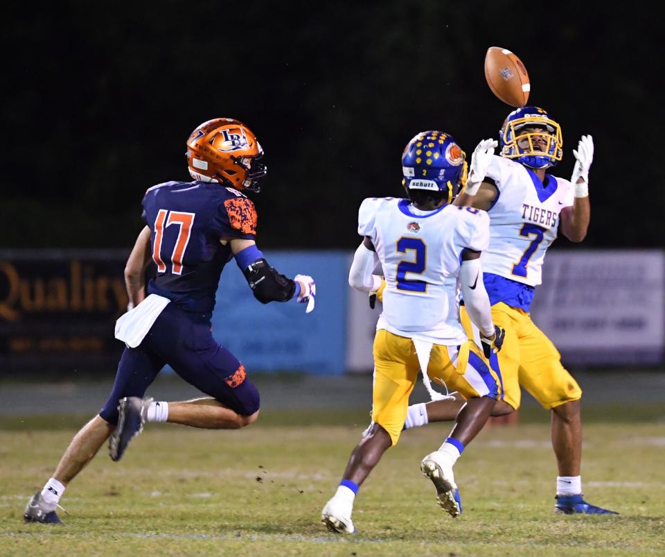 Clewiston defender Kenari Wilcher (#7) intercepts a pass intended for Lemon Bay wide receiver Aaron Pasick (#17). The Lemon Bay Manta Rays hosted the Clewiston Tigers in the Class 4A-Region 3 semi-final on Friday evening. 