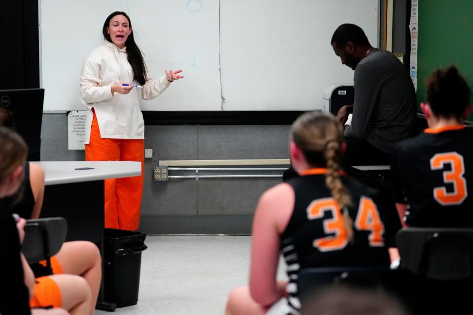 Hasbrouck Heights Girls Basketball Head Coach Molly Tague, speaks to her team during halftime, Tuesday, January 23, 2024. They were up 22-4 at the half and went on to beating Wallington, 50-8.