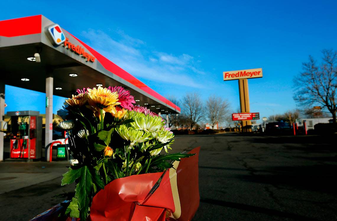 A colorful bouquet of flowers pays tribute to the victims of the February 2022 shooting inside the Fred Meyer store in Richland that killed one man and wounded another.