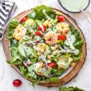 <p>This gorgeous green goddess salad combines fresh shrimp, cucumber, artichoke hearts and cherry tomatoes with homemade dressing. The green goddess dressing is beautifully green and creamy with avocado (loaded with good-for-you fats) and fresh herbs. Buttermilk and a dash of rice vinegar add tang. <a href="https://www.eatingwell.com/recipe/252138/green-goddess-salad/" rel="nofollow noopener" target="_blank" data-ylk="slk:View Recipe;elm:context_link;itc:0;sec:content-canvas" class="link ">View Recipe</a></p>