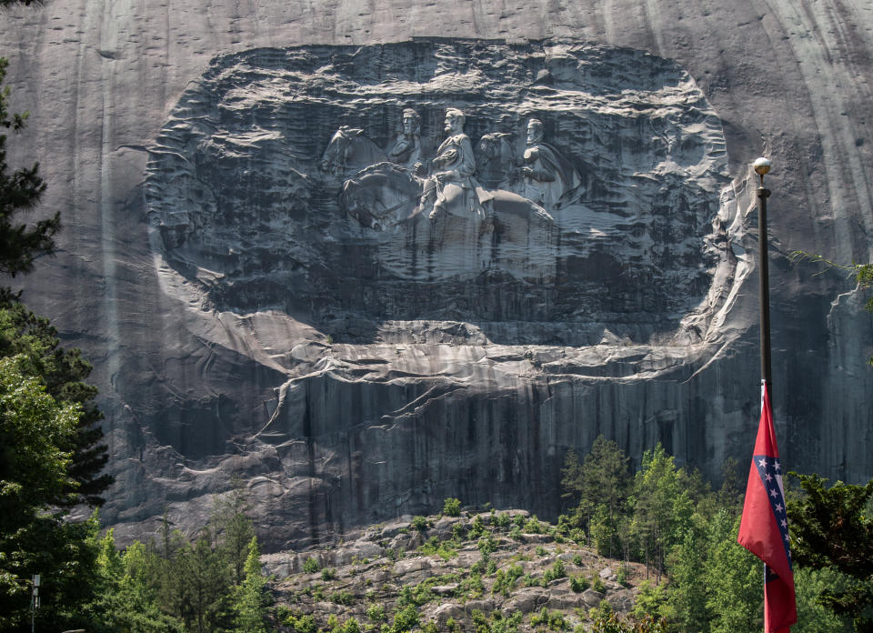 A carving on Stone Mountain honoring Confederate generals is shown on Monday, May 24, 2021, in Stone Mountain, Ga. The Stone Mountain Memorial Association board approved some minor changes in the popular park, located near Atlanta, but did not address any possible changes to the carving or streets named after Confederate generals as some had hoped. (AP Photo/Ron Harris)