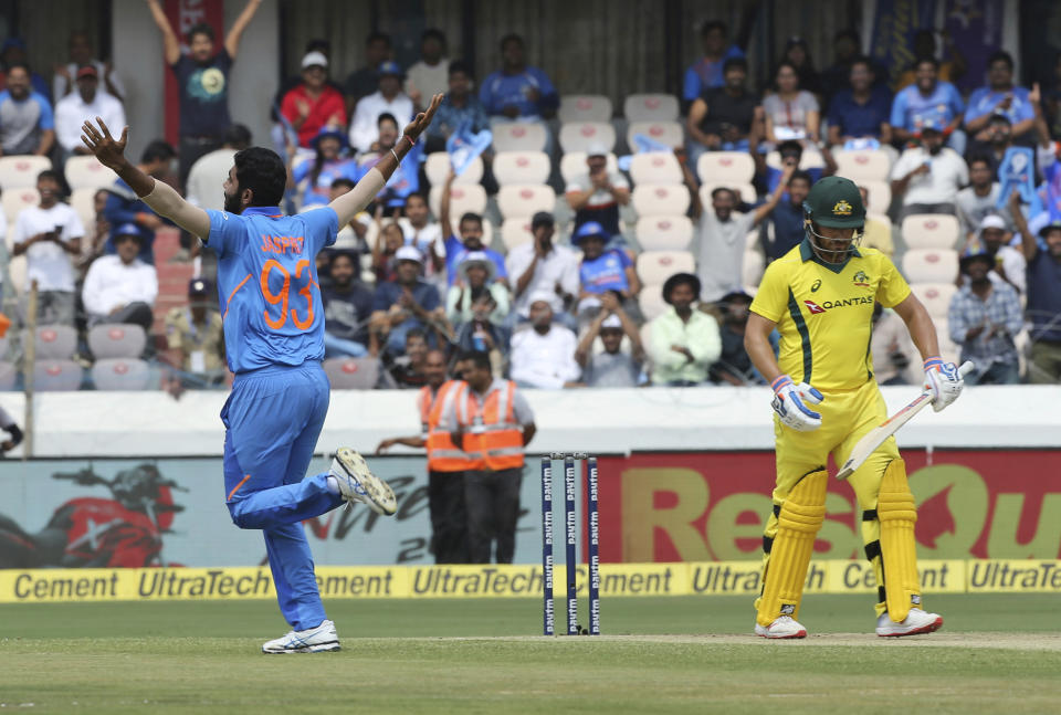 Indian bowler Jasprit Bumrah celebrates the wicket of Australia's Aaron Finch during the first one-day international cricket match between India and Australia in Hyderabad, India, Saturday, March 2, 2019. (AP Photo/Mahesh Kumar A.)