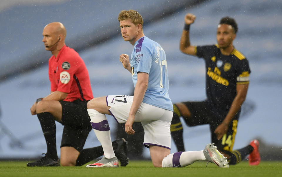 MANCHESTER, ENGLAND - JUNE 17: Kevin De Bruyne of Manchester City takes a knee in support of the Black Lives Matter movement prior to the Premier League match between Manchester City and Arsenal FC at Etihad Stadium on June 17, 2020 in Manchester, United Kingdom. (Photo by Peter Powell/Pool via Getty Images)