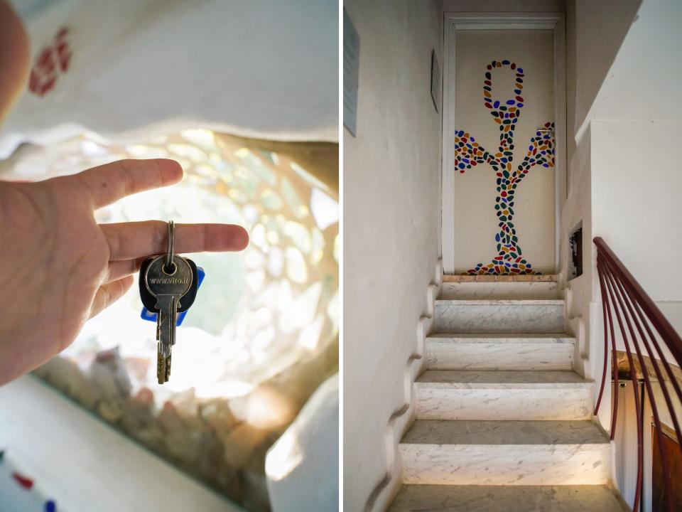 The keys and door leading up to the livable sculpture Airbnb in Rome