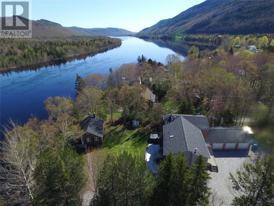 <p><span>12 Forest Dr., Steady Brook, Nfld.</span><br> The property is close to the Humber River, giving you the perfect place to park a boat. The property also has a guest house.<br> (Photo: Zoocasa) </p>