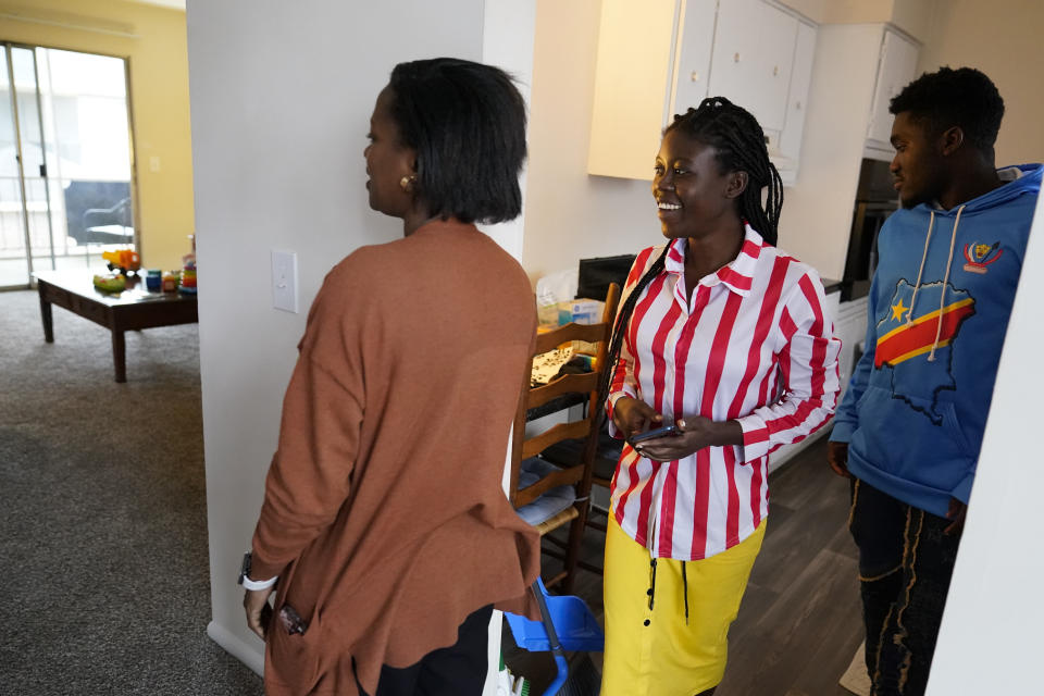 Lutheran Services Carolinas employment specialist Yvonne Songolo, from left, gives Congo refugees Riziki Kashindi and her husband Sadock Ekyochi, a tour of their new apartment, Thursday, April 11, 2024, in Columbia, S.C. The American refugee program, which long served as a haven for people fleeing violence around the world, is rebounding from years of dwindling arrivals under former President Donald Trump. The Biden administration has worked to restaff refugee resettlement agencies and streamline the process of vetting and placing people in America. (AP Photo/Erik Verduzco)