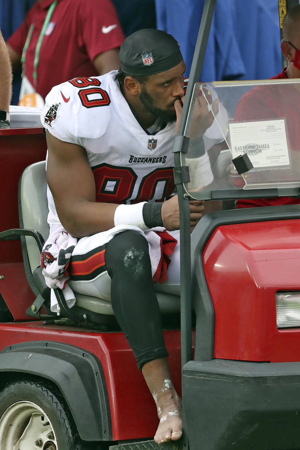 Tampa Bay Buccaneers tight end O.J. Howard (80) reacts as he leaves the field after getting injured against the Los Angeles Chargers during the second half of an NFL football game Sunday, Oct. 4, 2020, in Tampa, Fla. (AP Photo/Mark LoMoglio)