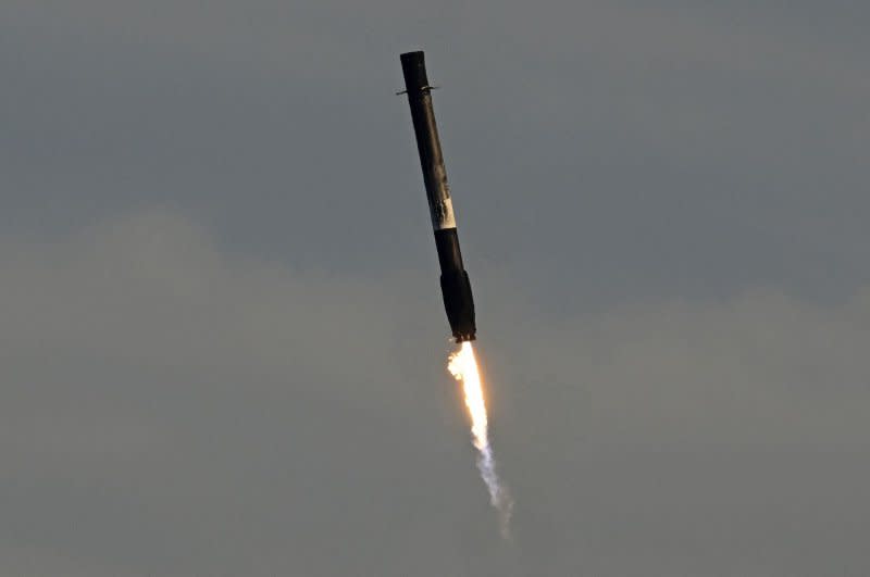 The first stage of the SpaceX Falcon 9 returns to Landing Zone 1 on Wednesday. Photo by Joe Marino/UPI