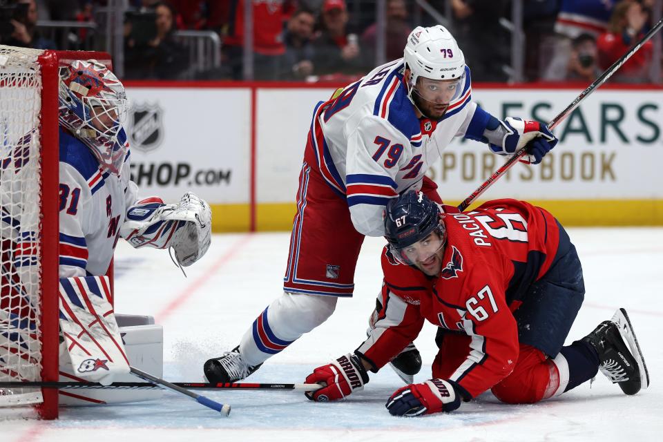 WASHINGTON, DC - APRIL 26: Max Pacioretty #67 of the Washington Capitals is held to the ice by K'Andre Miller #79 of the New York Rangers during the second period in Game Three of the First Round of the 2024 Stanley Cup Playoffs at Capital One Arena on April 26, 2024 in Washington, DC.
